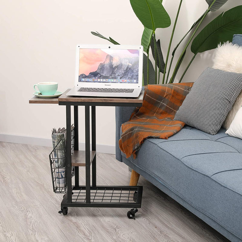 c shaped side table with wheels next to sofa