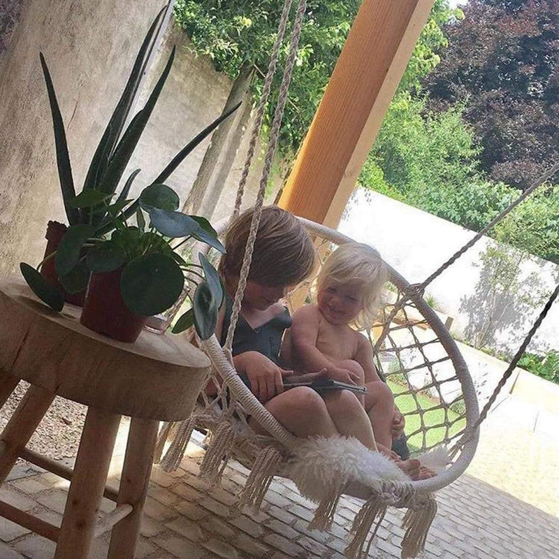 two children on the macrame hammock chair