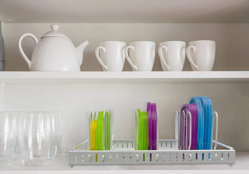 pan lid storage rack in the cupboard